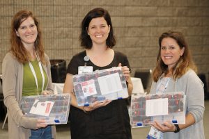 women showing off craft kits