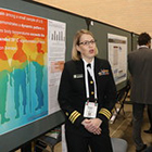uniformed woman talking about public health poster