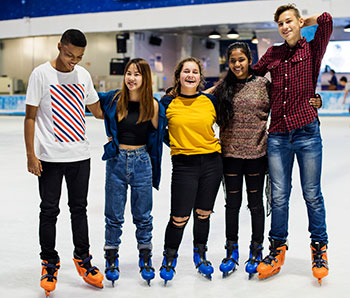 teen girls and boys at ice rink