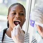 Woman getting mouth swab test