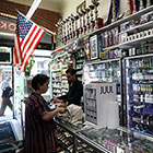 woman at counter with e-cigarettes