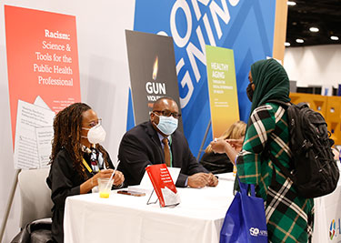 woman at book signing with Chandra Ford and Derek Griffith