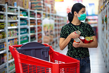 Masked woman in grocery store