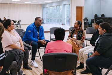 Jerry Hawkins talks to program participants