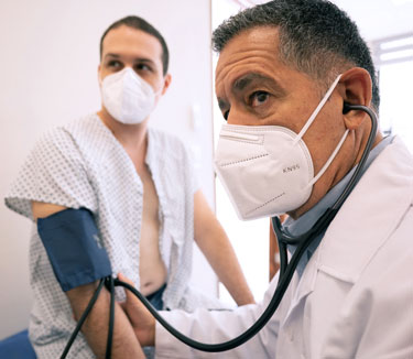 A doctor examines a patient