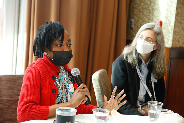 A woman asks a question during Affiliate Day on Saturday