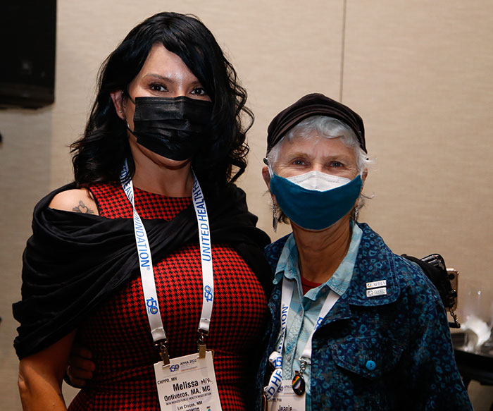 Two attendees pose at the Council of Affiliates meeting.