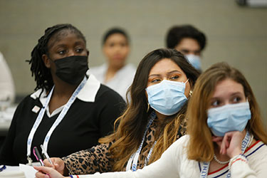 Three student attendees at National Student Meeting