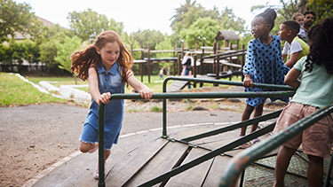 A girl plays at a playground