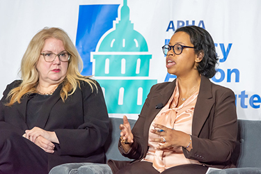 Federal health agency leaders Carole Johnson, left, and Chiquita Brooks-LaSure speak at PAI June 15, 2023