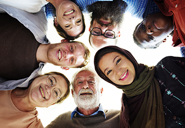 People of different ages, diversities smile at the camera