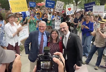 Three former CDC leaders are pictured outside the agency at a celebration of public health following their resignation.