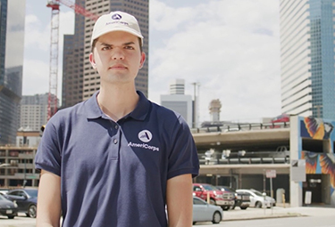 A man who is a volunteer at Public Health AmeriCorps poses for the camera