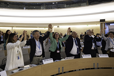 People attending the World Health Assembly celebrate when the Pandemic Agreement was approved May 20.
