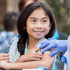 Young girl gets vaccinated