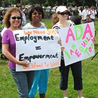 People hold signs supporting Americans with Disabilities Act